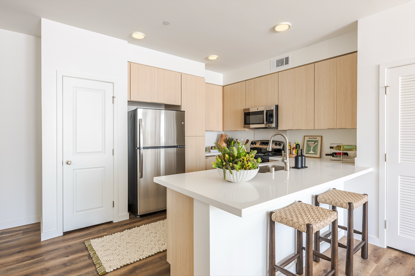 Kitchen with breakfast bar and stainless steel appliances
