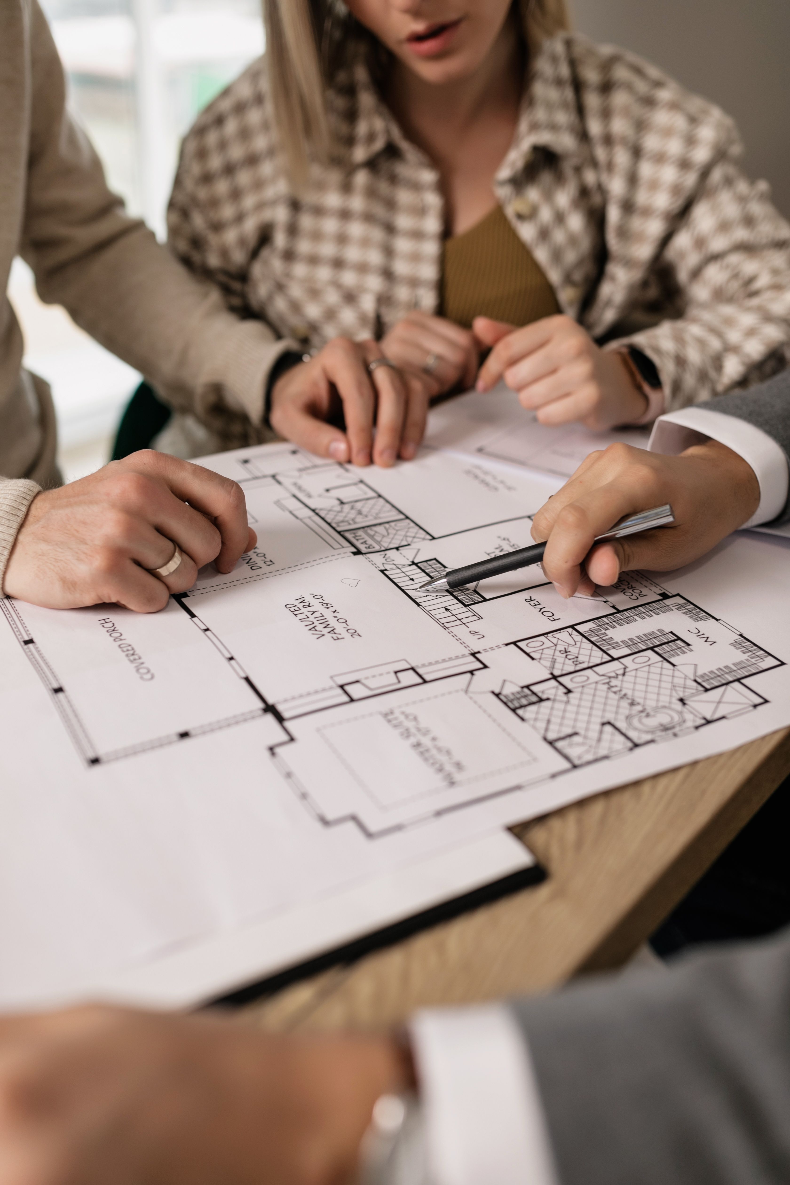 Homeowners reviewing bathroom remodel plans during a free consultation