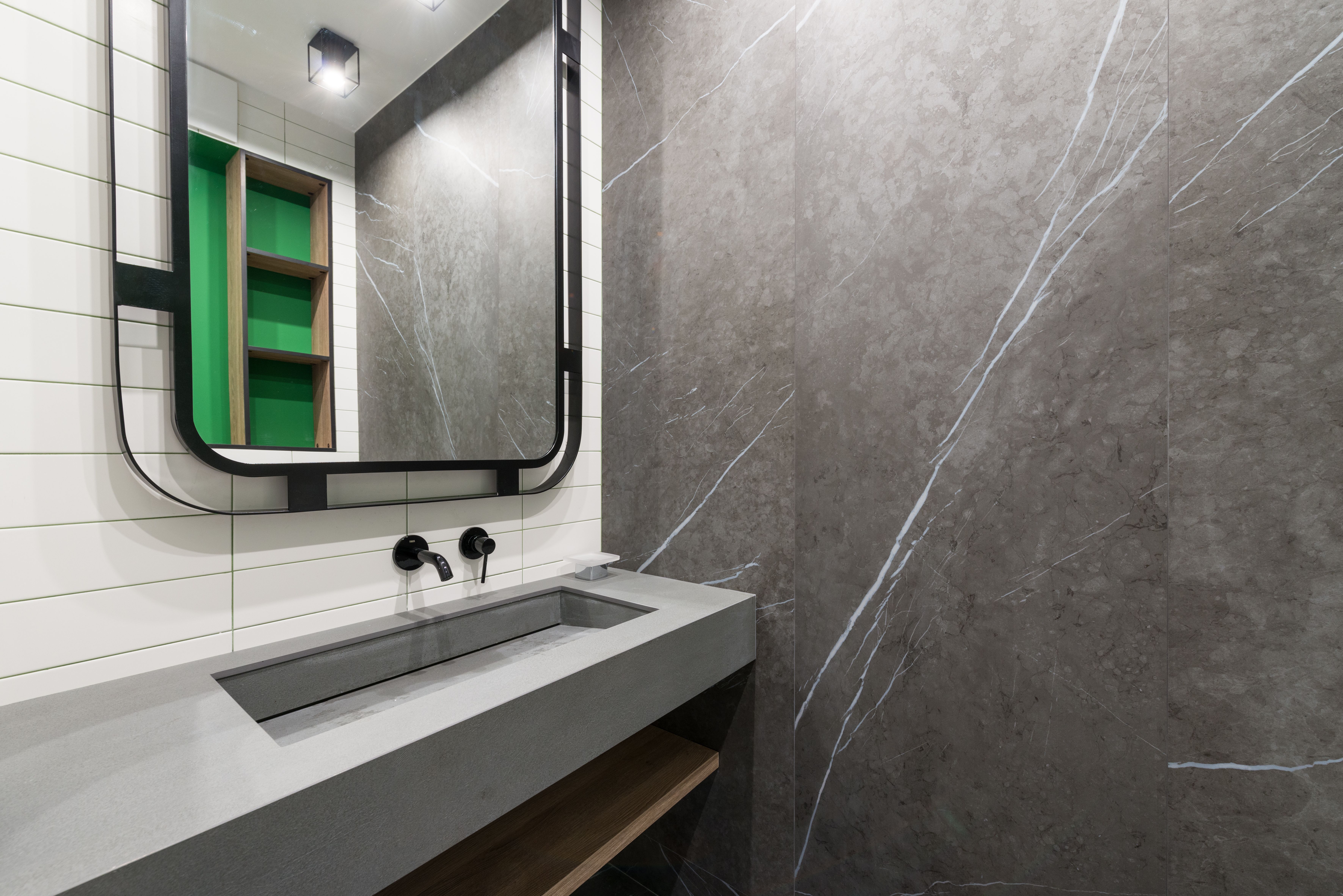 Modern finished bathroom with vanity and mirror