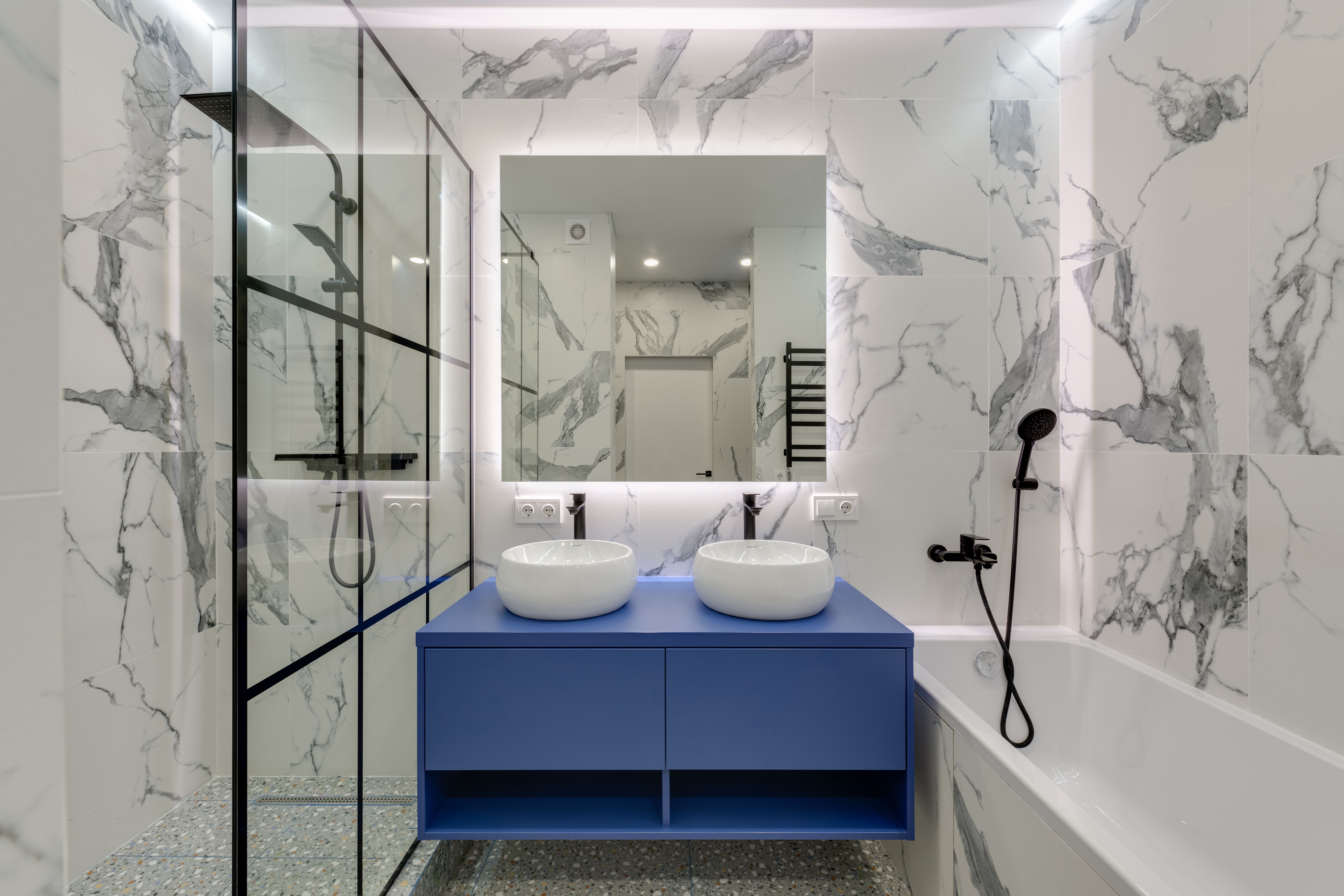 Remodeled full bathroom with vanity and shower