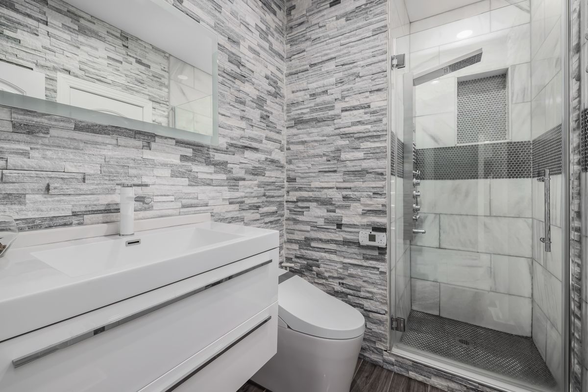 Modern bathroom with glass shower and vanity