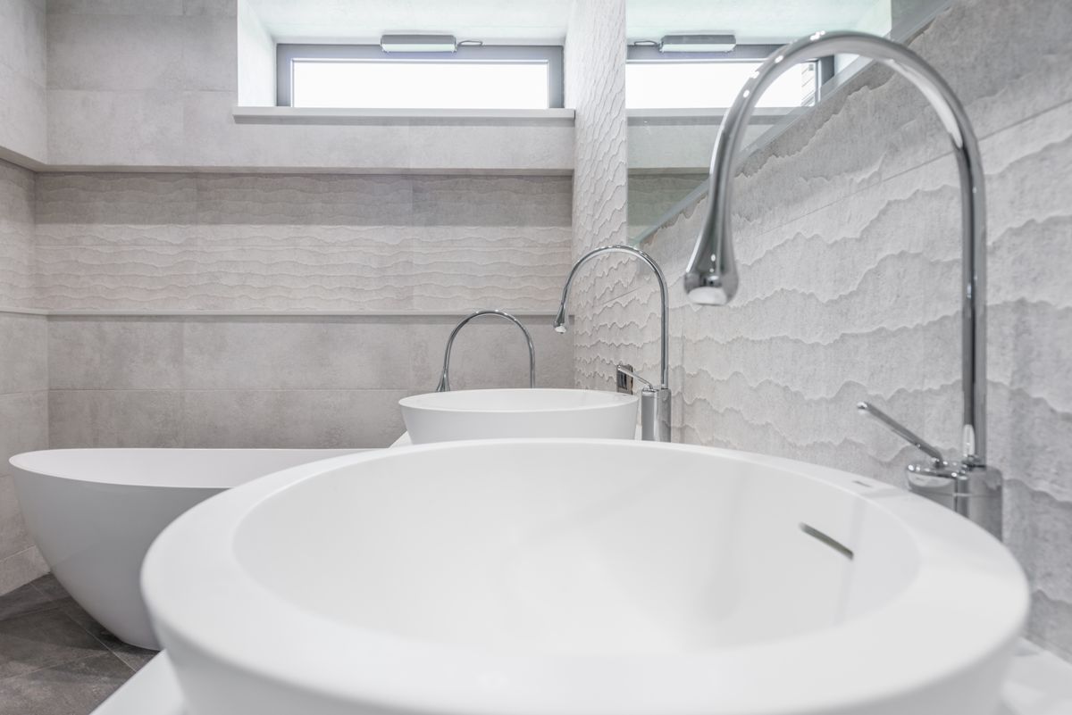 Bathroom sinks and faucets being installed