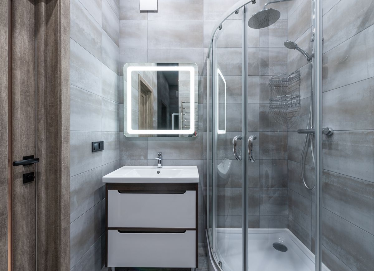Modern walk-in glass shower in a remodeled bathroom