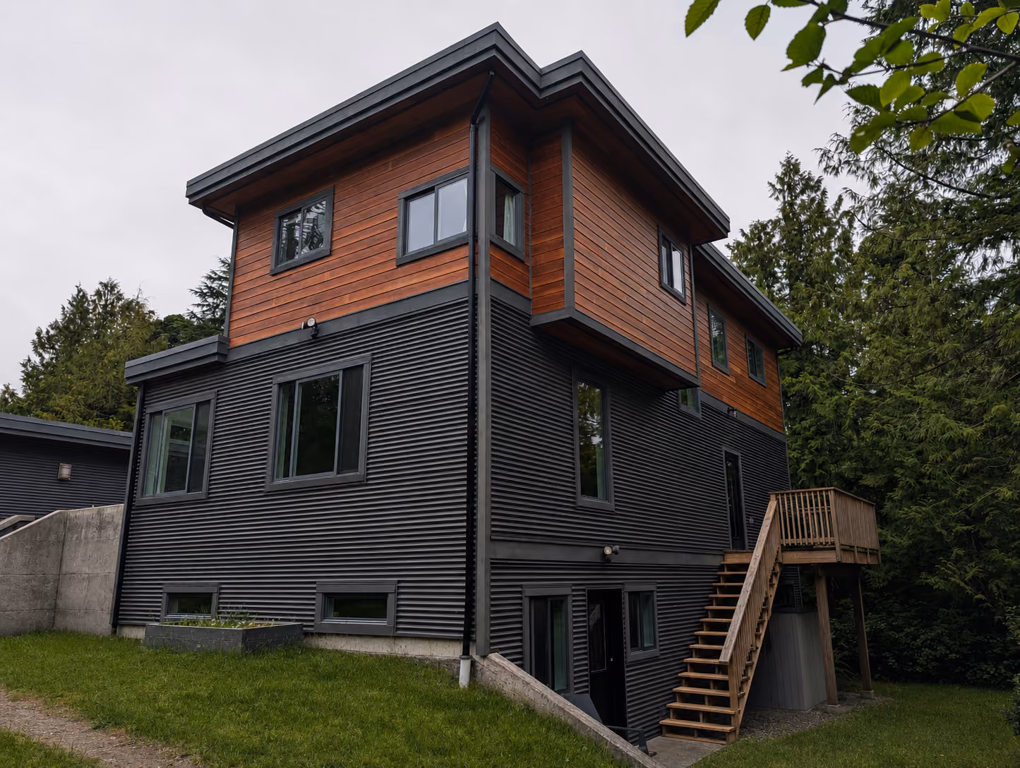 Rainstone Developments contemporary custom home in west coast style with natural textures of wood and stone