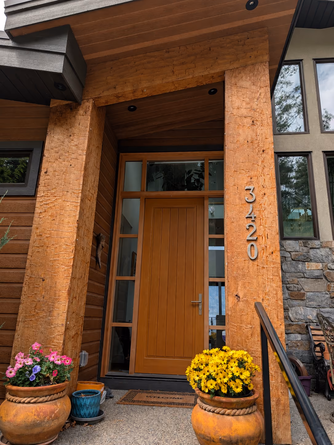 Rainstone Developments contemporary custom home in west coast style with natural textures of wood and stone
