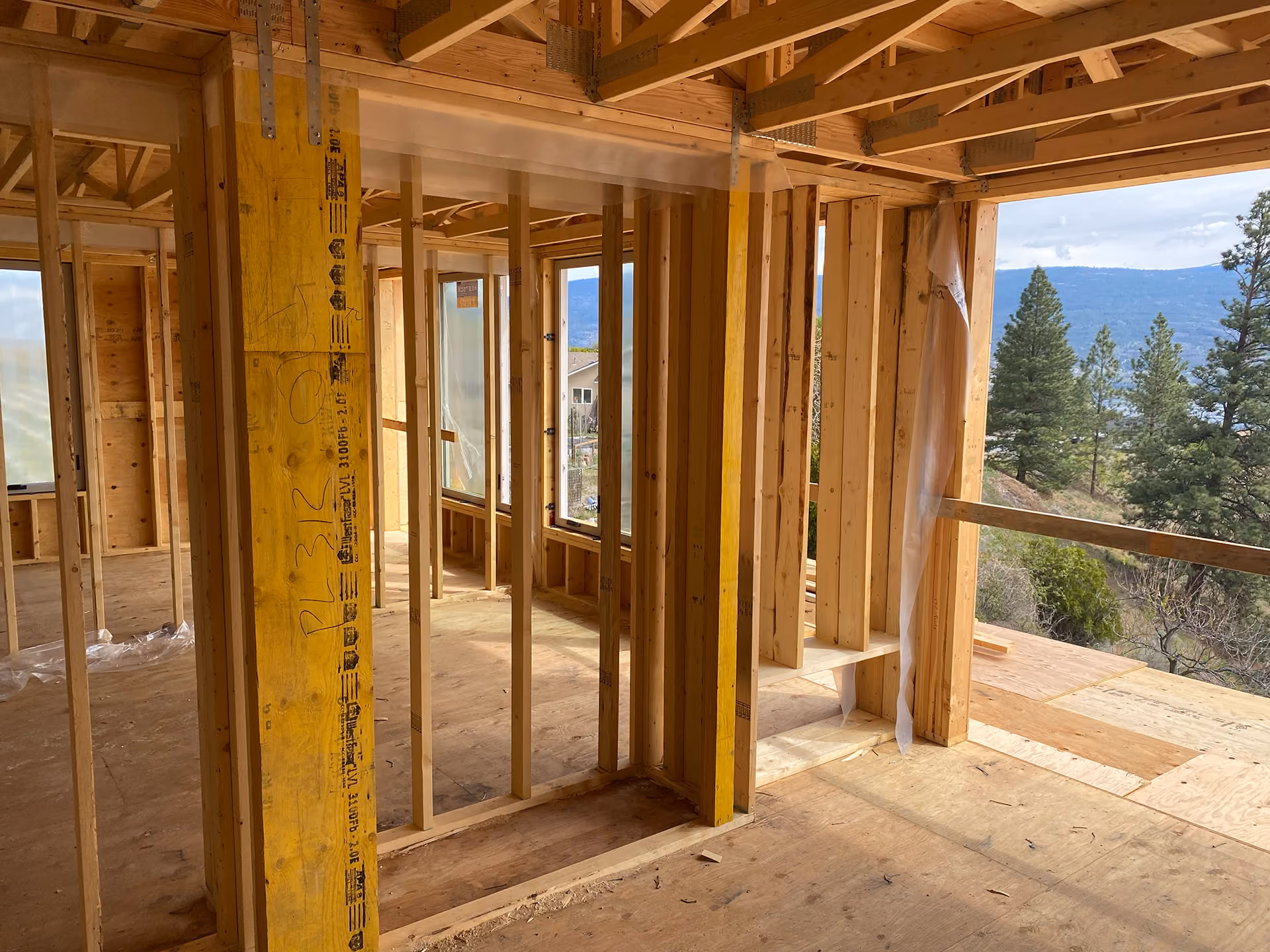 custom home under construction, showing framing and view