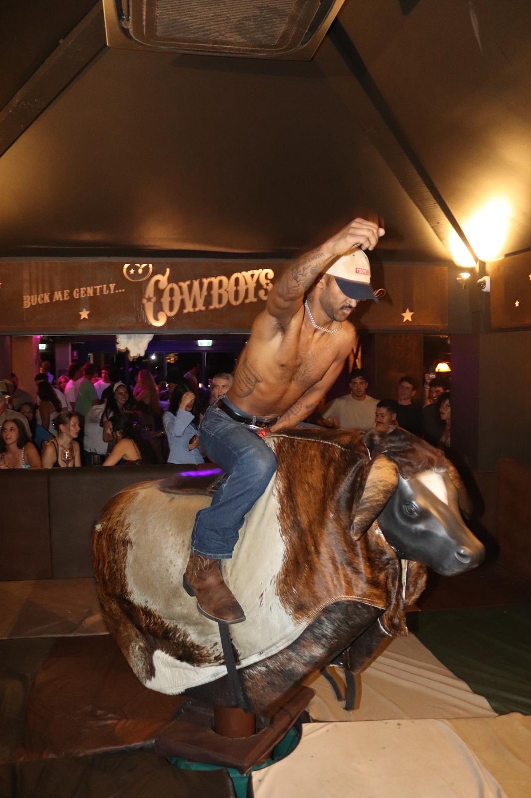 Rider taking on the mechanical bull at Cowboys Surfers Paradise