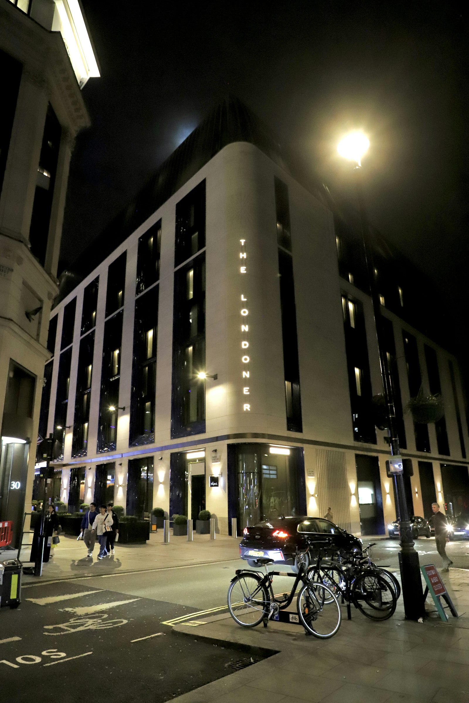 The Langham-style luxury hotel in London at night