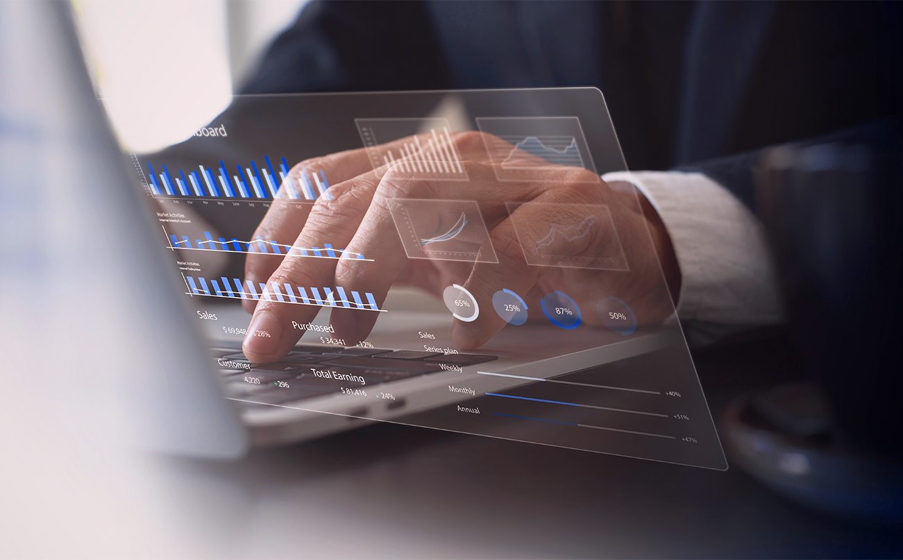 Hand touching business dashboard screen
