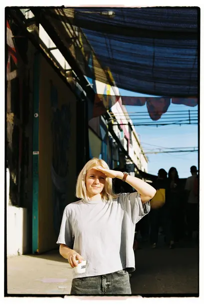 blonde girl with soft smile in the sun