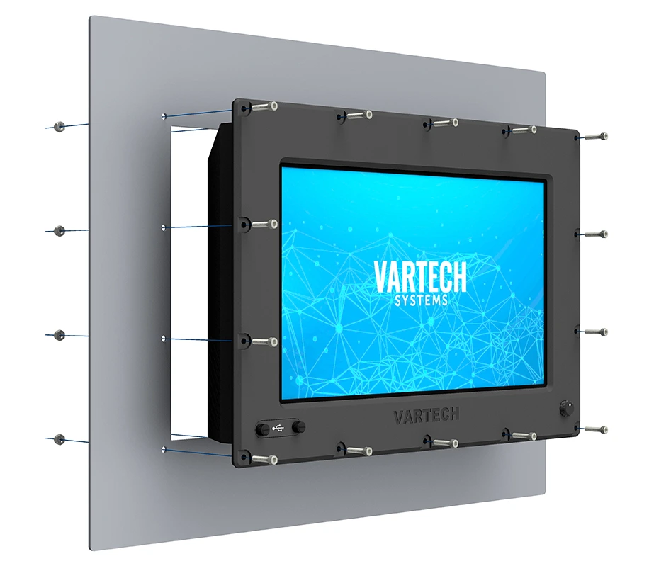Wall-mounted touchscreen device with VARTECH SYSTEMS on blue screen and multiple screws securing it.