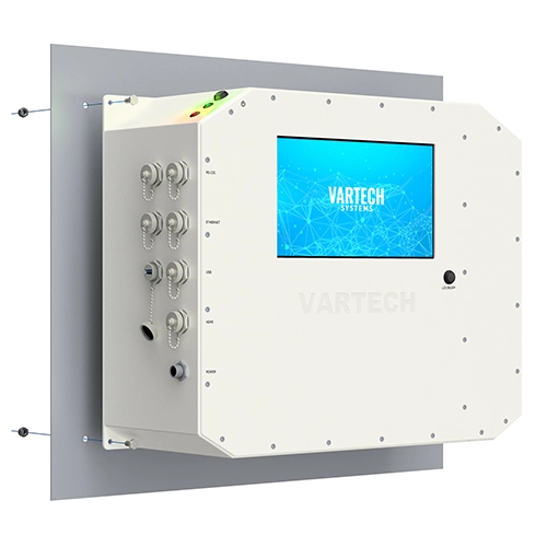 Wall-mounted VARTECH SYSTEMS control panel with monitor and multiple connectors on the side.