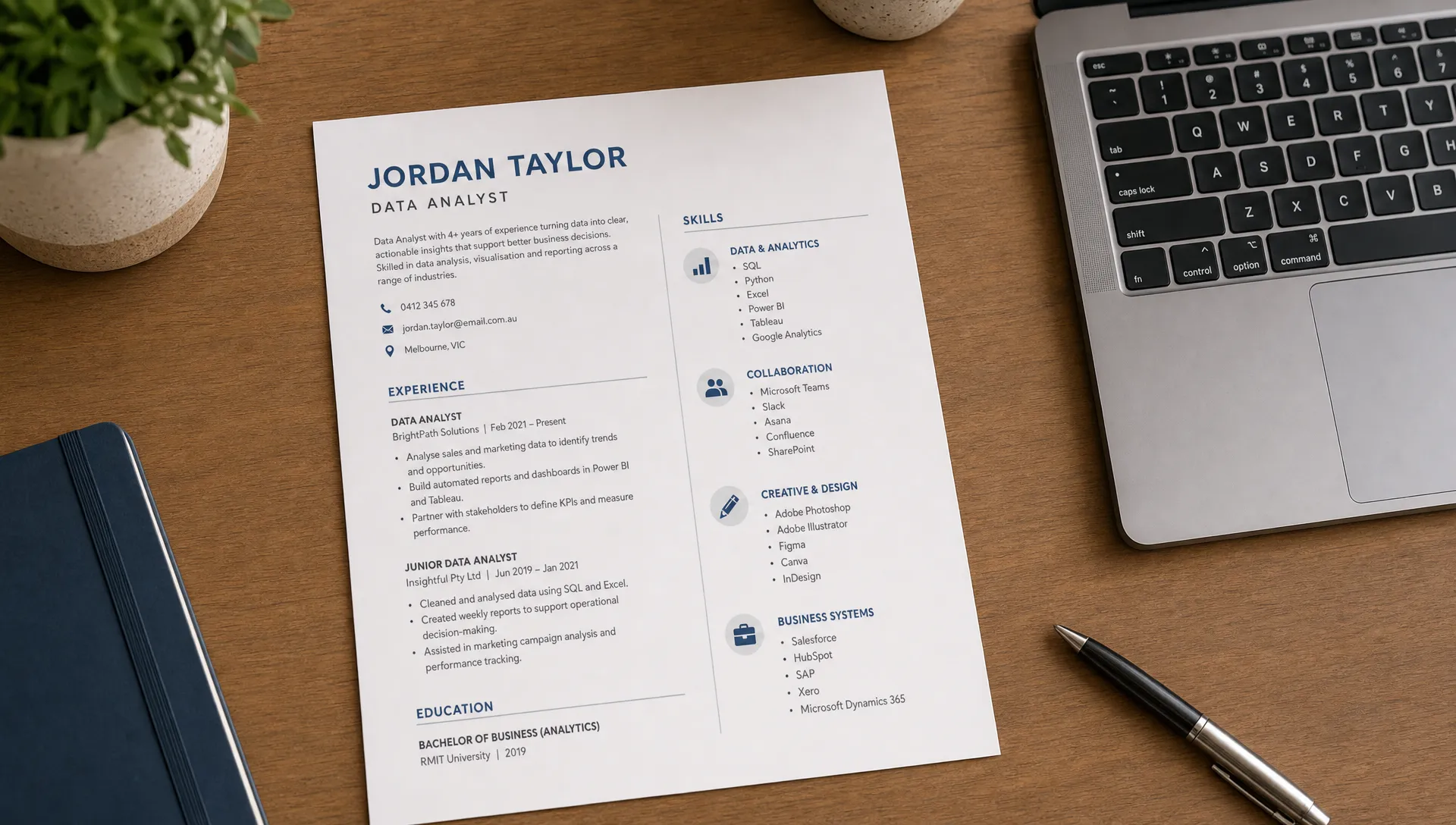 A clean resume draft on a desk beside a laptop showing grouped technology skill categories, including data tools, collaboration platforms, creative software, and business systems.