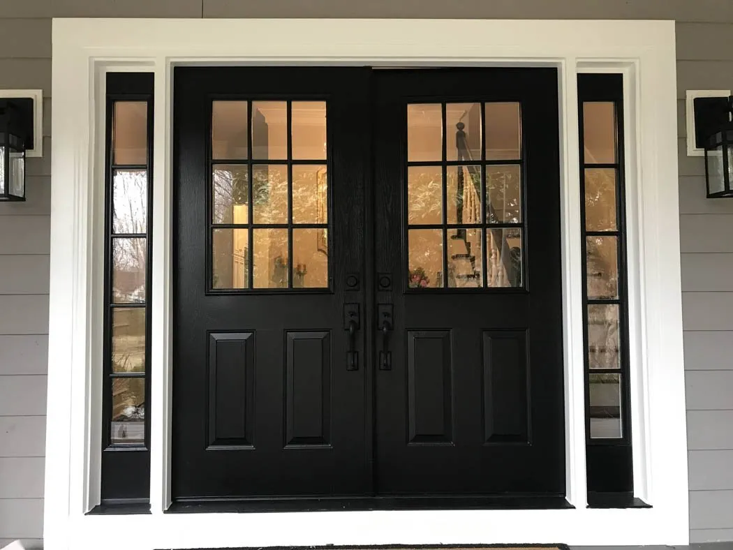 Black double entry doors with nine-lite glass and full sidelites