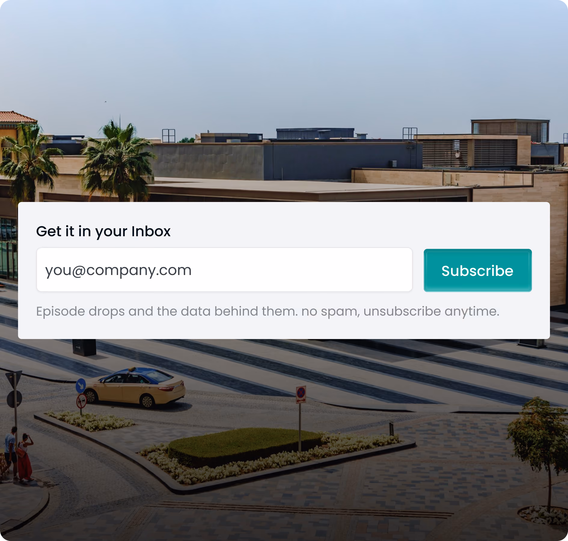 Subscription form overlay on city scene with email input and green Subscribe button.