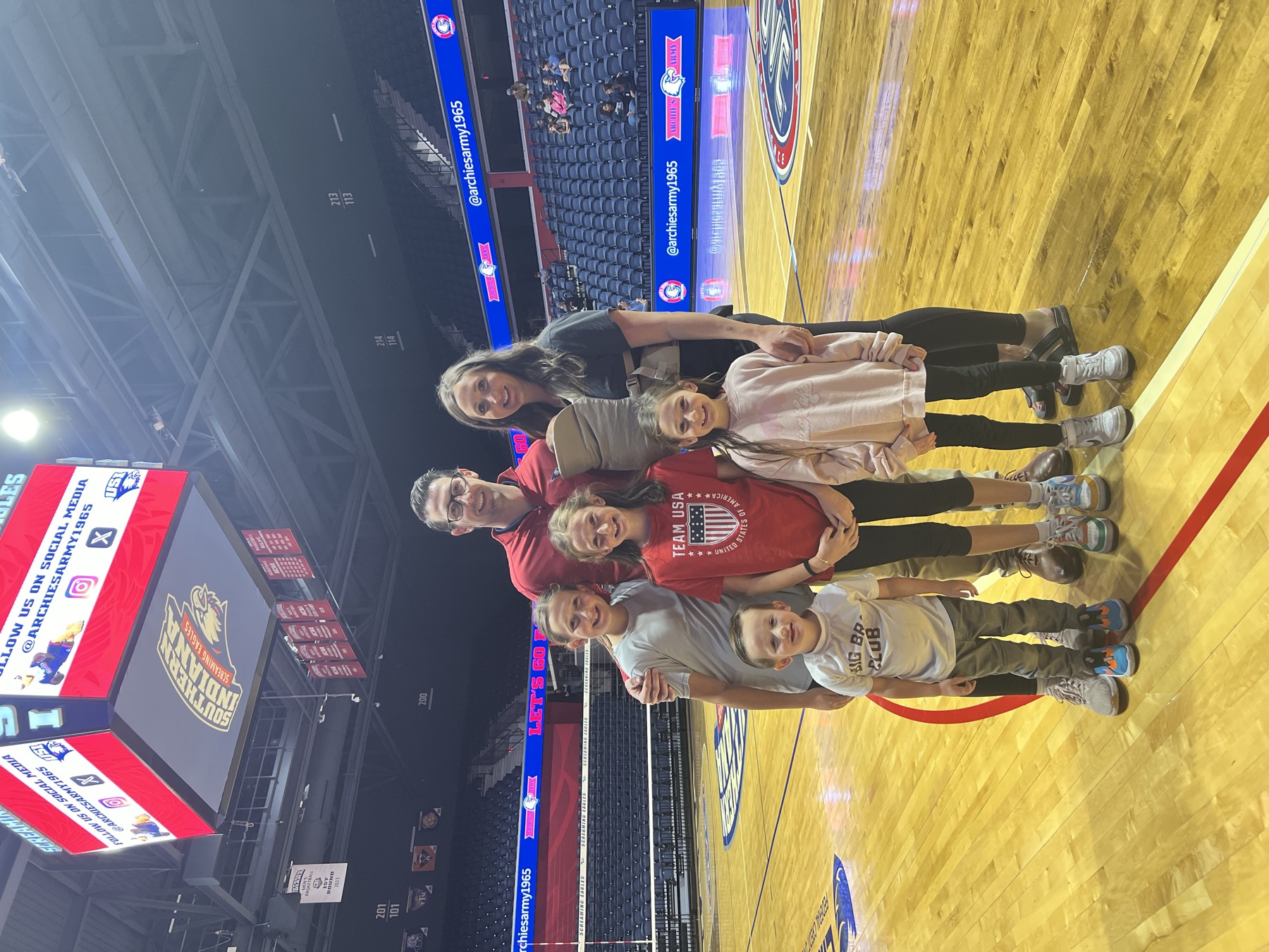 Dr. Kelly and his family courtside at a University of Southern Indiana game