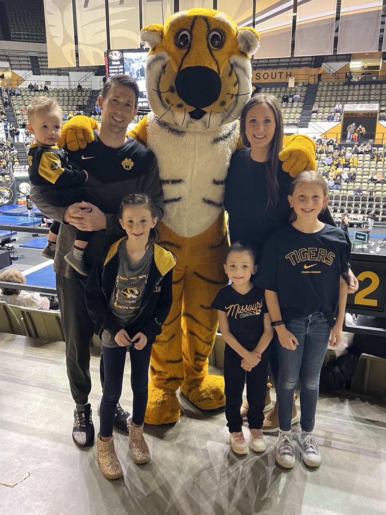 Family at a Mizzou game with the mascot