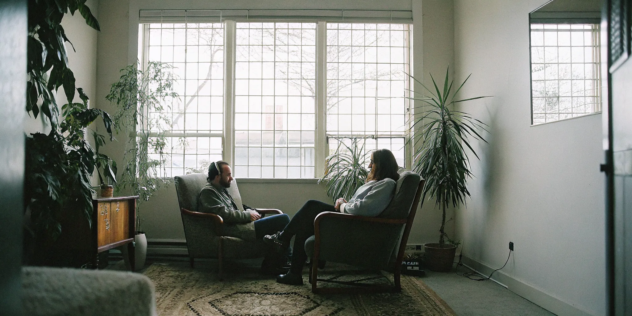 VAWA psychological evaluation session with a clinician and client in a warm therapy office