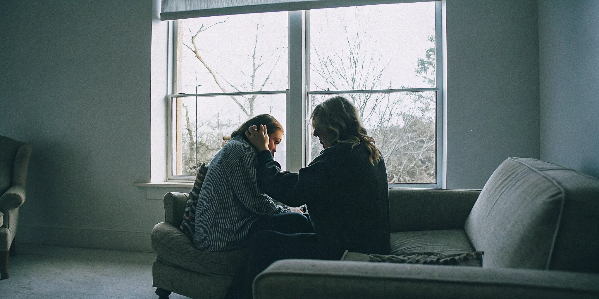 Therapist offering empathetic counseling to a client in a calm, sunlit Fairfax office