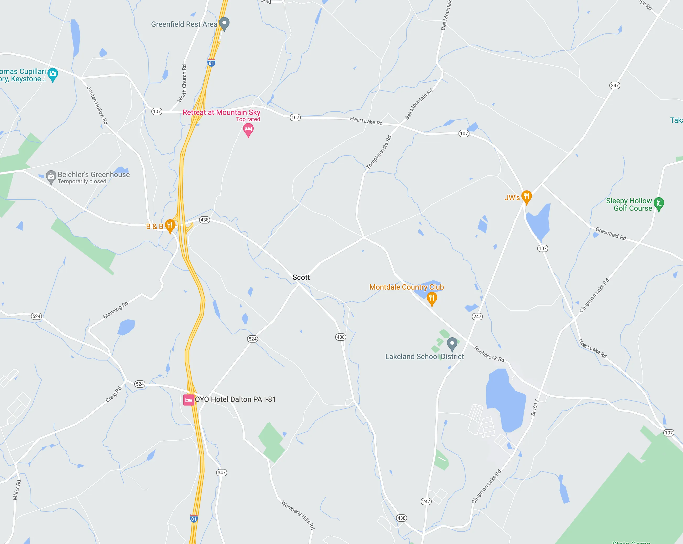 A map of a town with a yellow line on it.