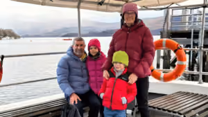 Family on Loch Leven, Scotland; Boat trips on Scottish Loch. Multi-generational travel in Scotland