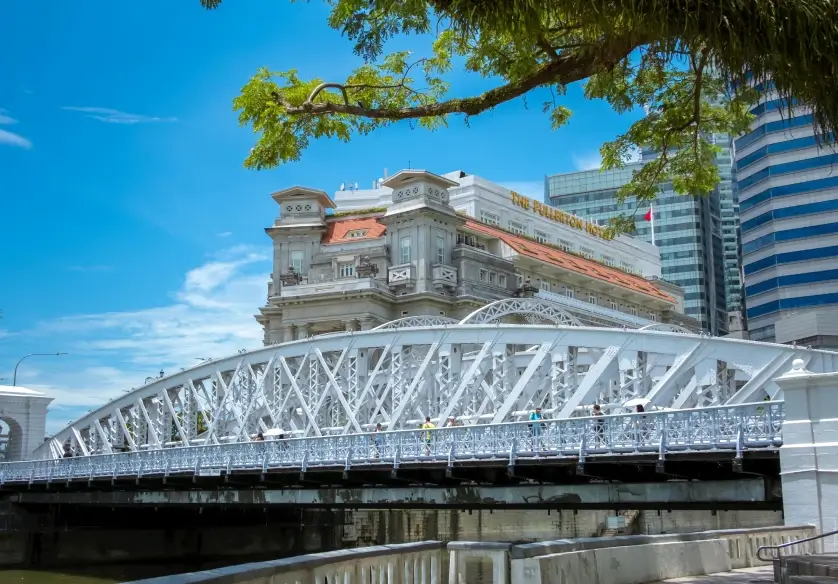 Cavenagh Bridge and The Fullerton Hotel along the Singapore River