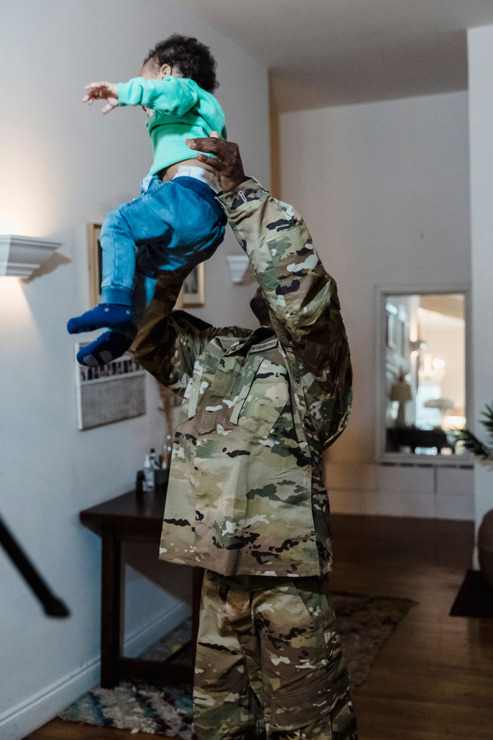 A service member reuniting with their child