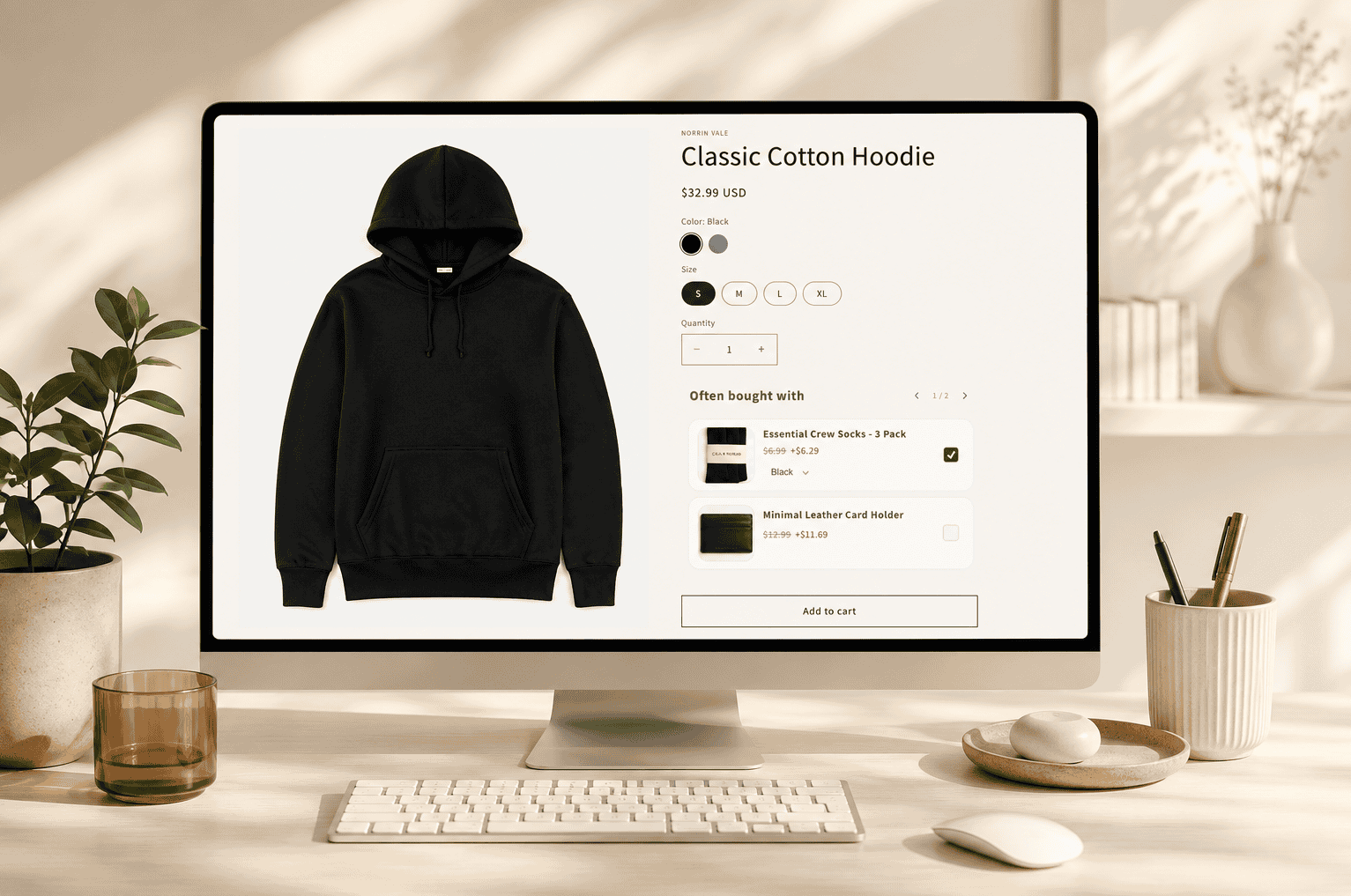 Computer screen showing an online store page for a $32.99 black classic cotton hoodie, size small selected.