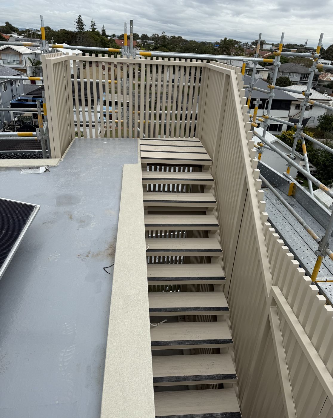 Powder-coated aluminium stair, balustrade and privacy screen to a rooftop terrace