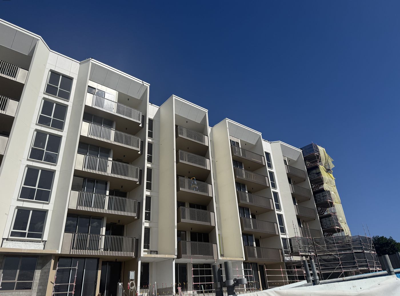 Apartment facade with powder-coated aluminium balcony balustrades