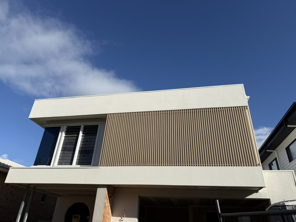 Timber look aluminium batten cladding to an upper level facade
