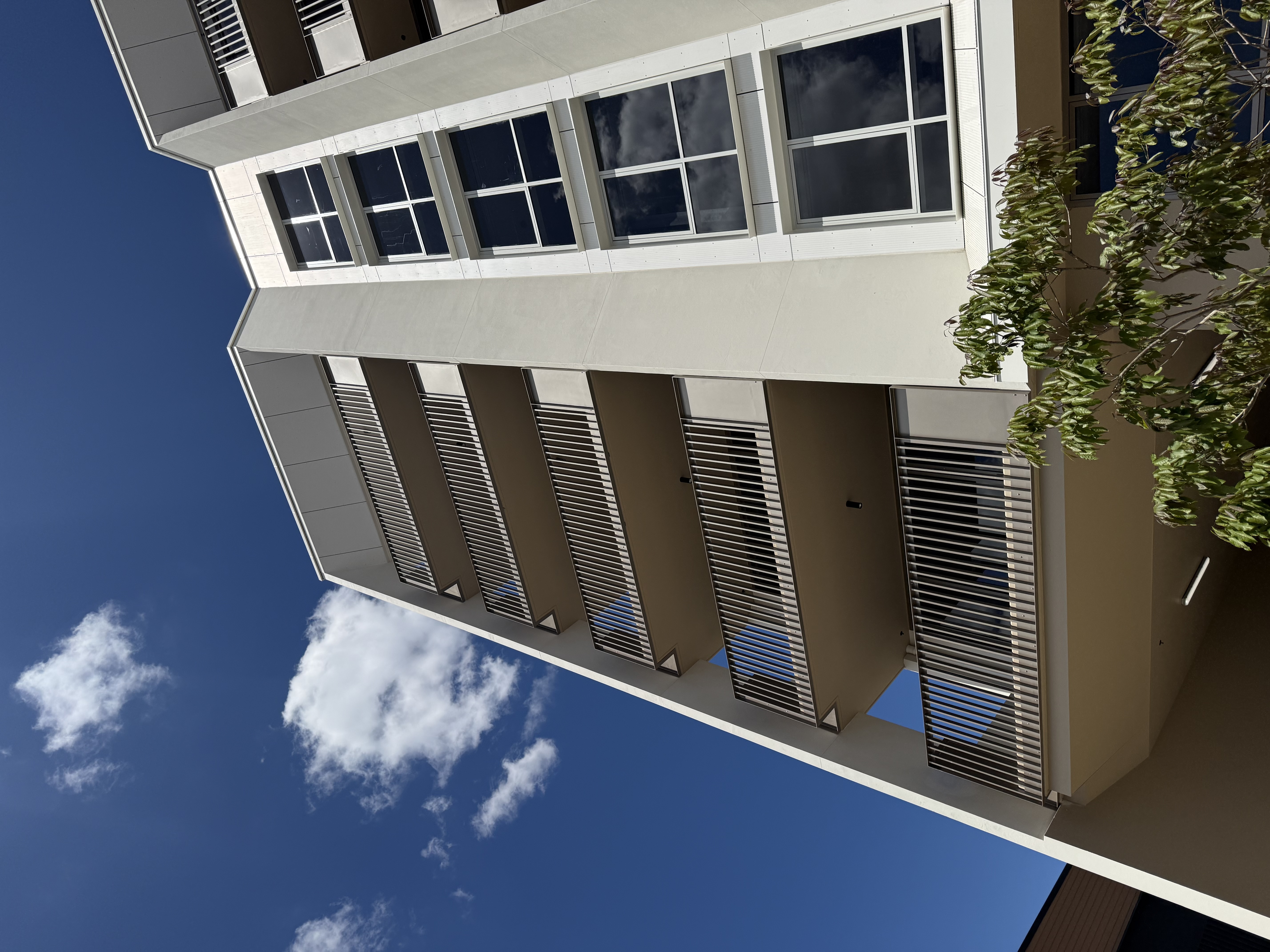 Vertical bar aluminium balustrades to apartment balconies, viewed from below