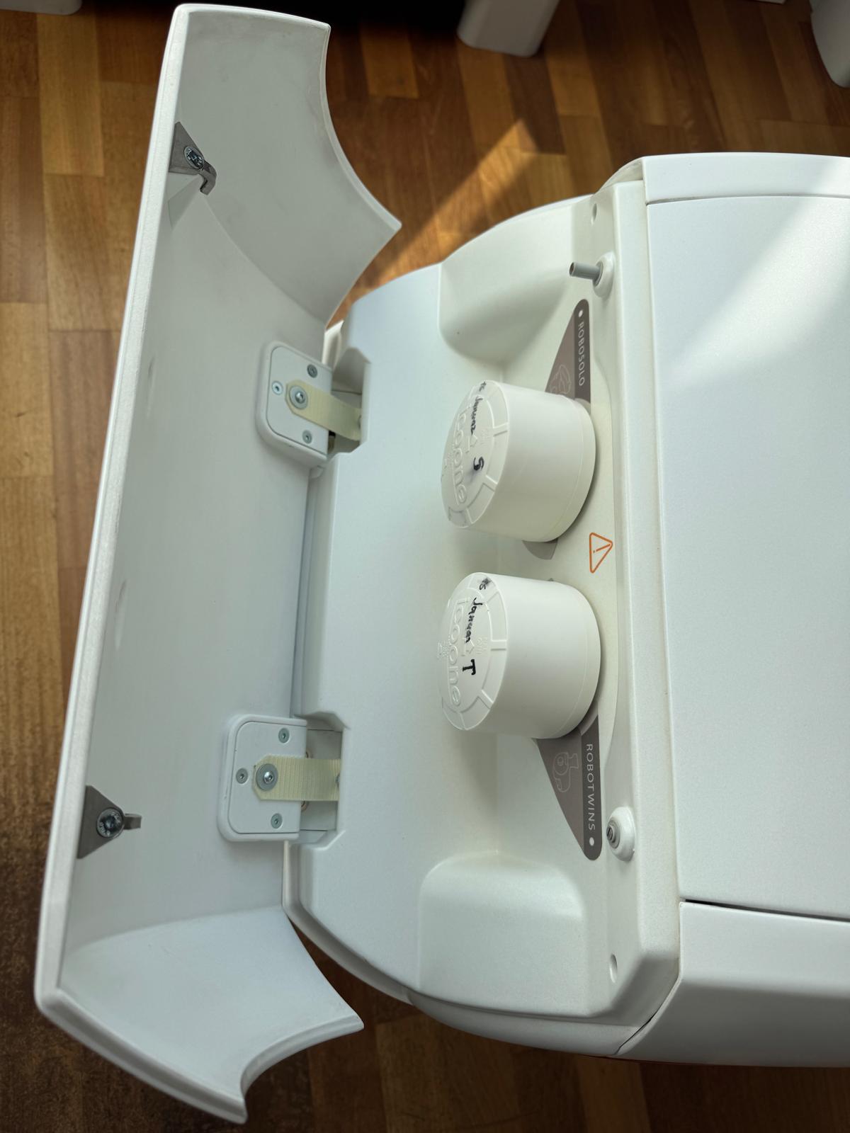 ICOONE Laser Beauty treatment handpieces and accessories stored inside the original device compartment