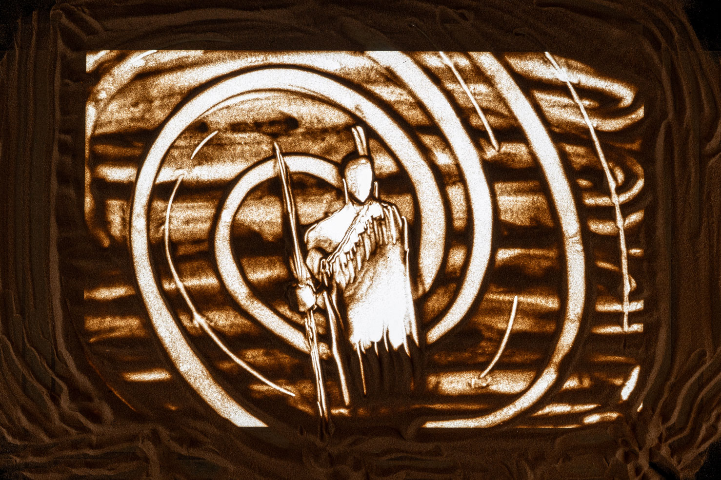 Sand art of a ruanuku in traditional attire with spiral patterns in the background.