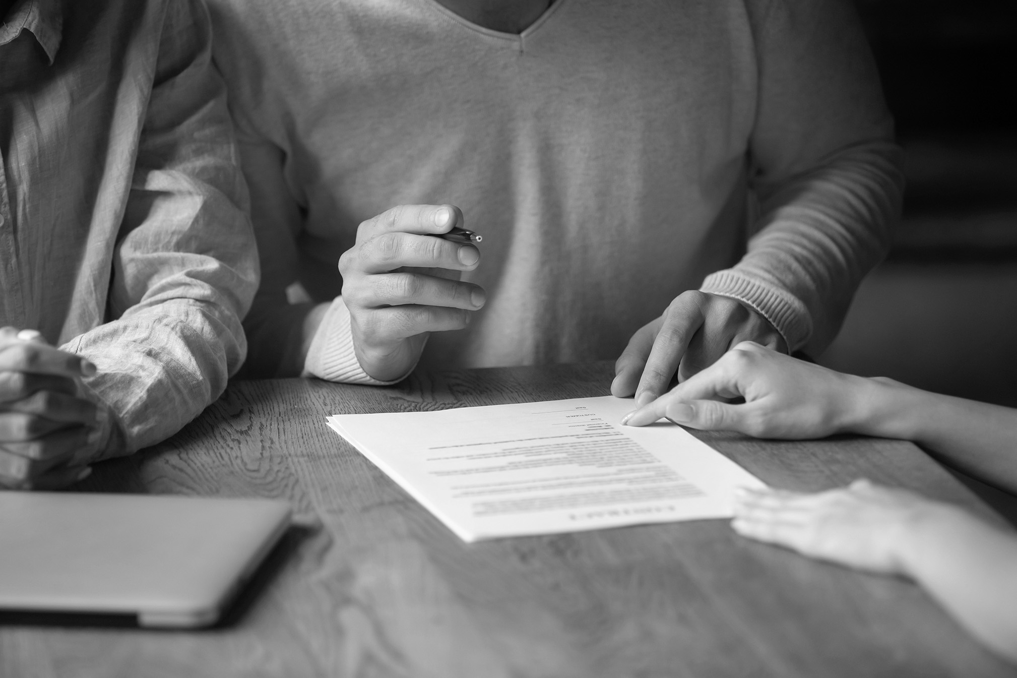 image of handshake over contract for property management company