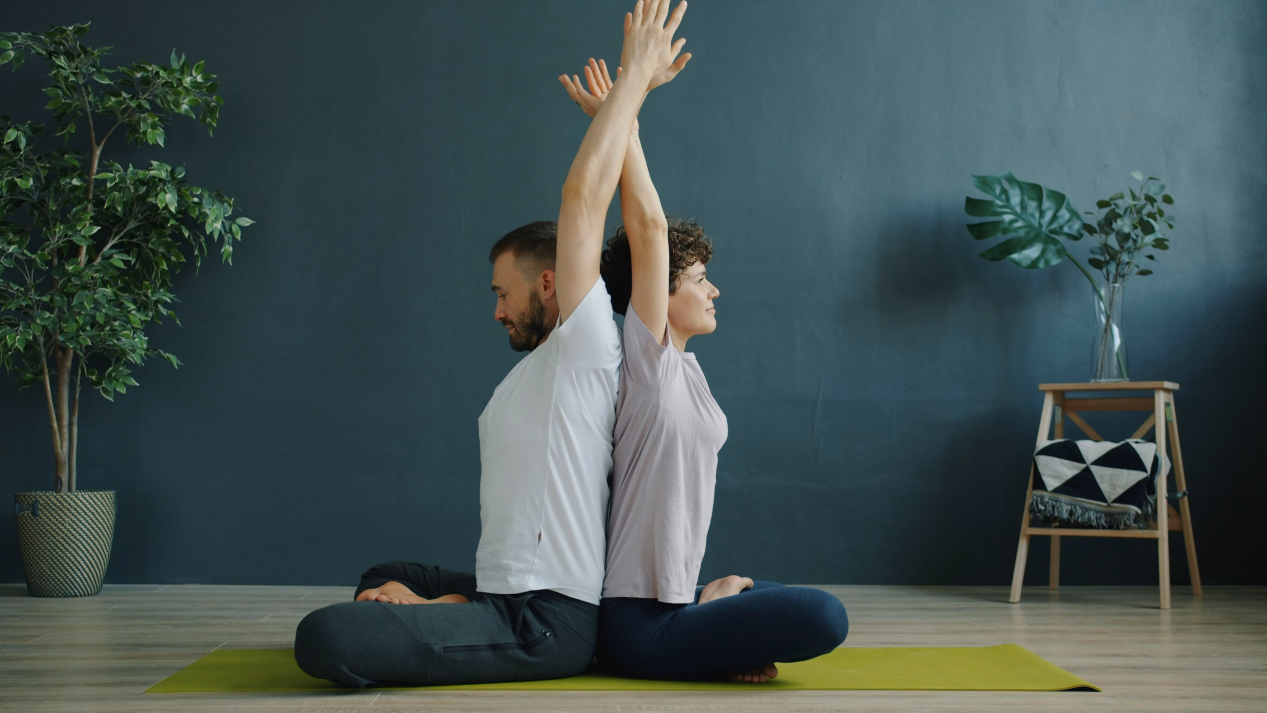 Image of two people doing yoga together