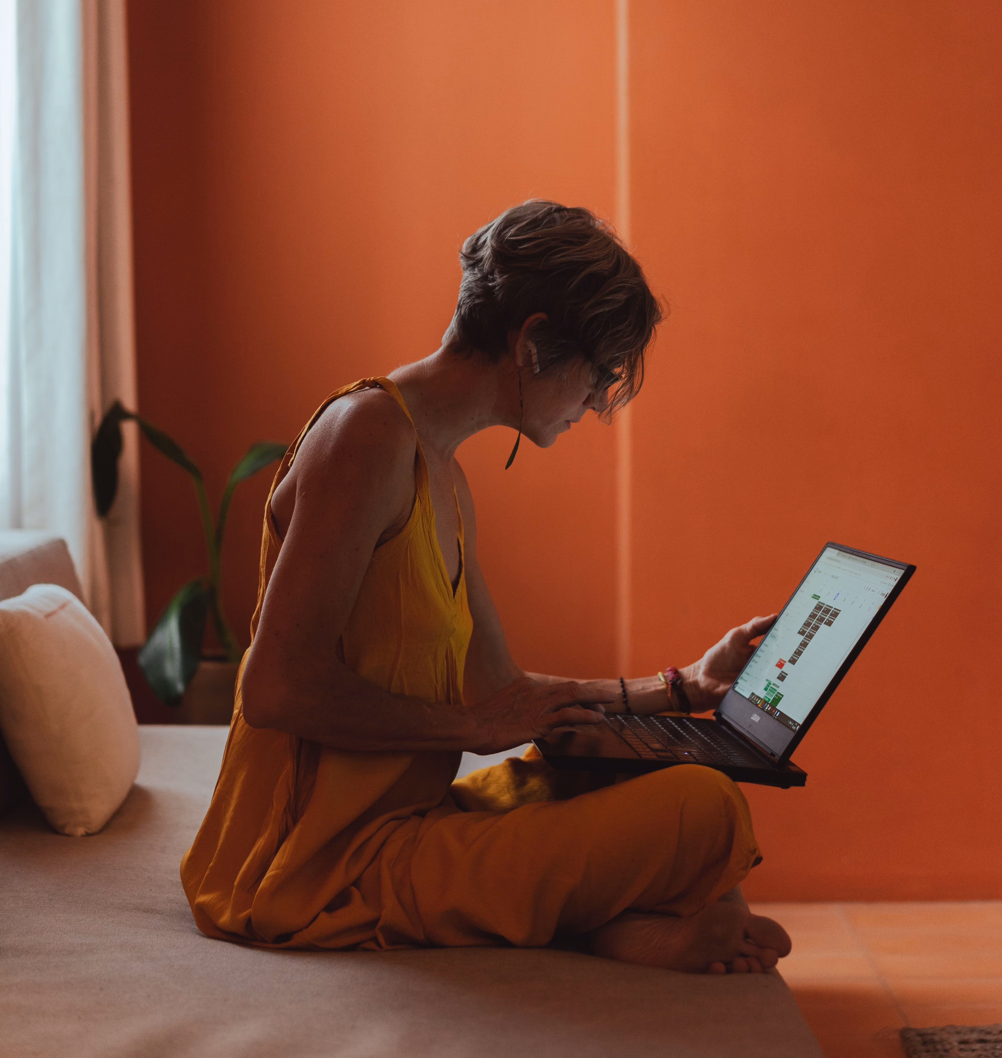 pilates studio owner working on her website and schedule
