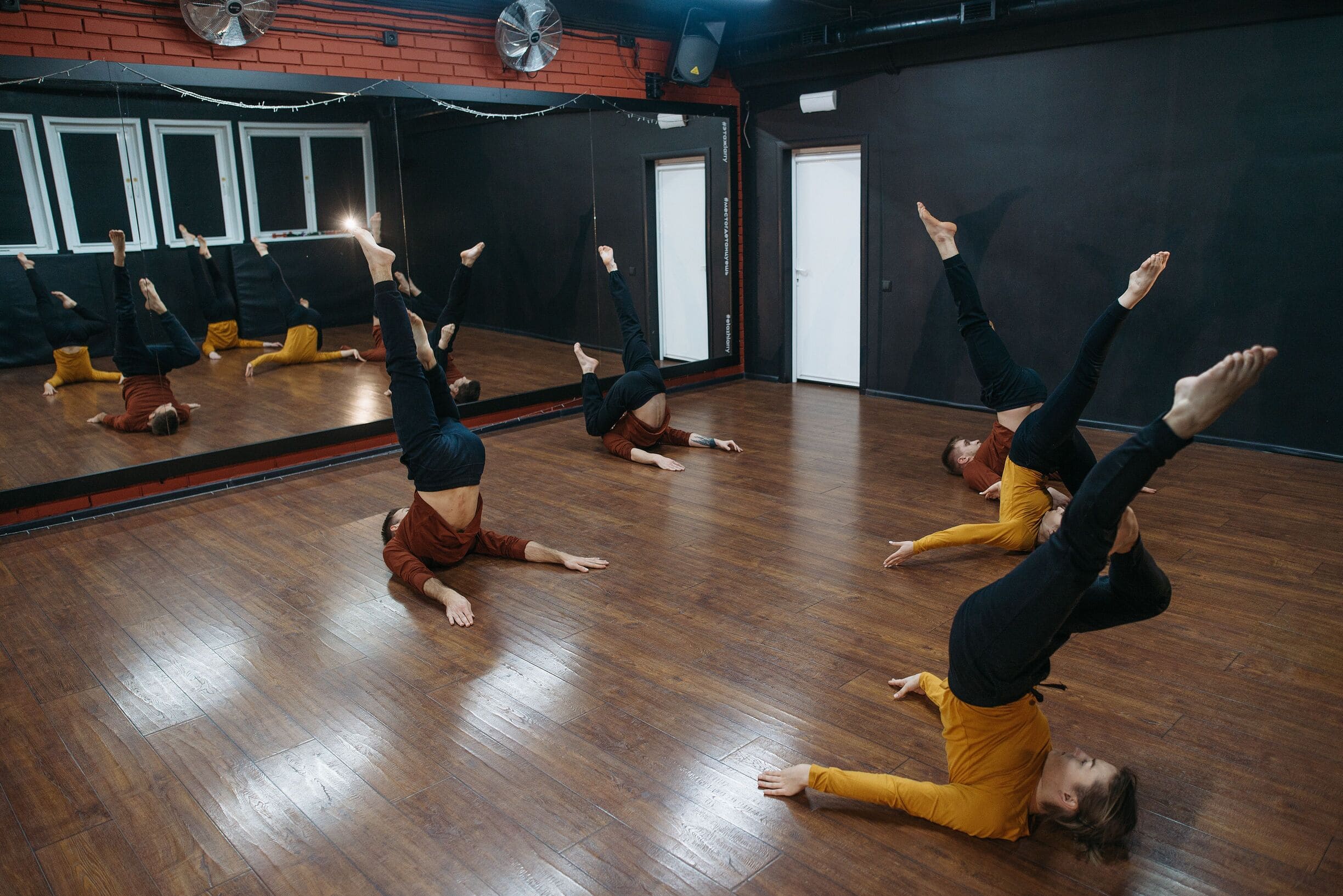 Group of dancers practicing in a dance studio space