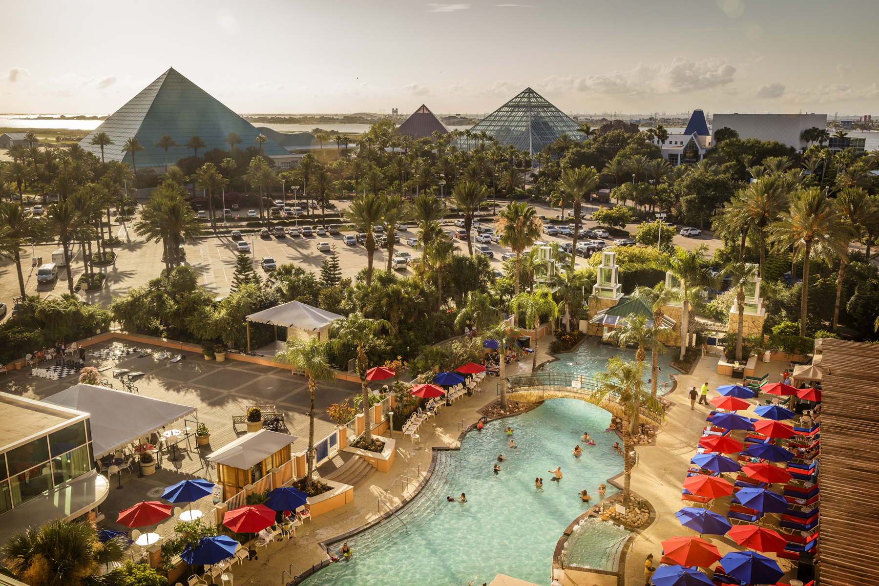 Aerial view of the Moody Gardens glass pyramids above the hotel's resort pool.