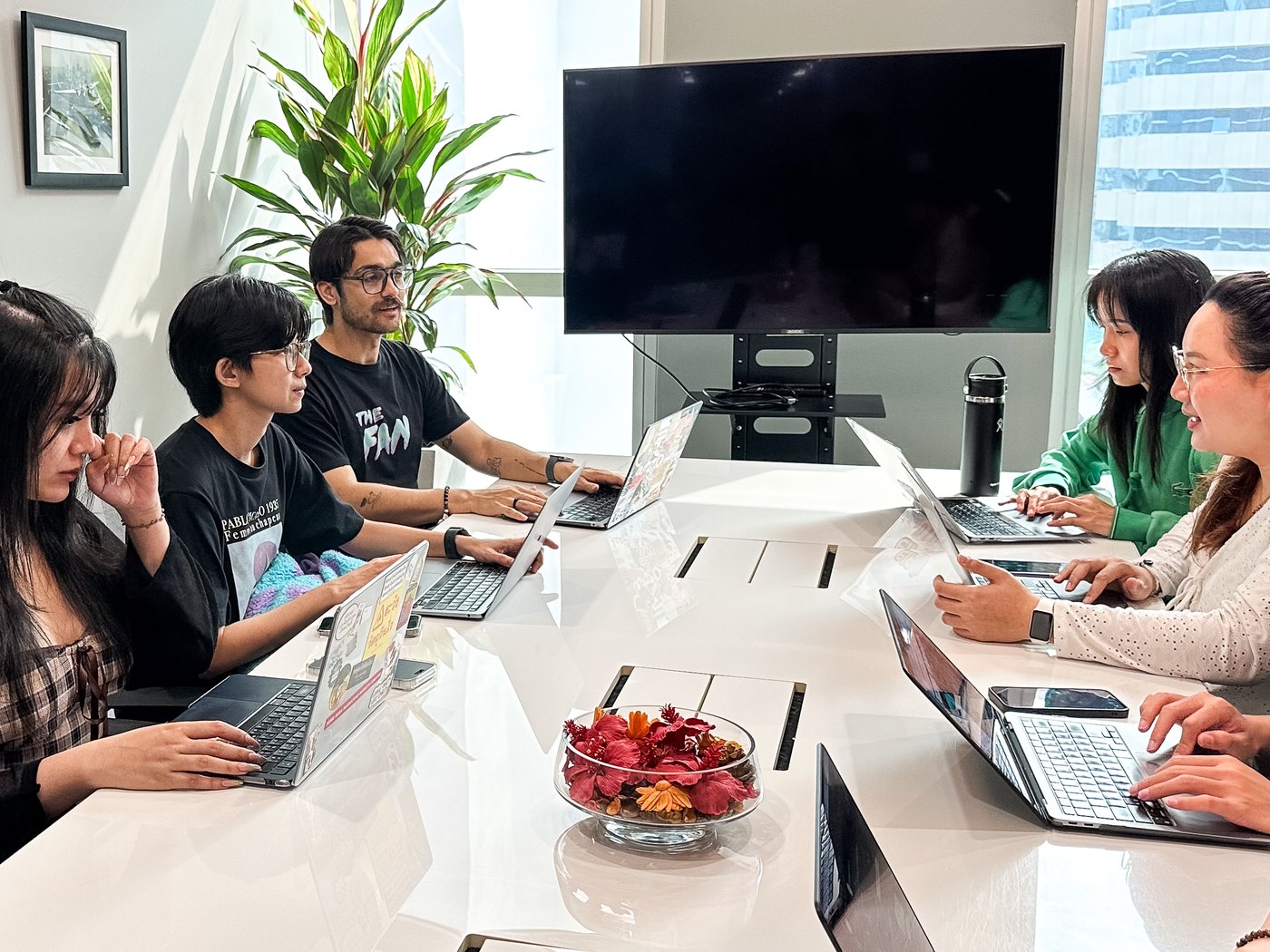 Adfinity team briefing creators in the Bangkok office
