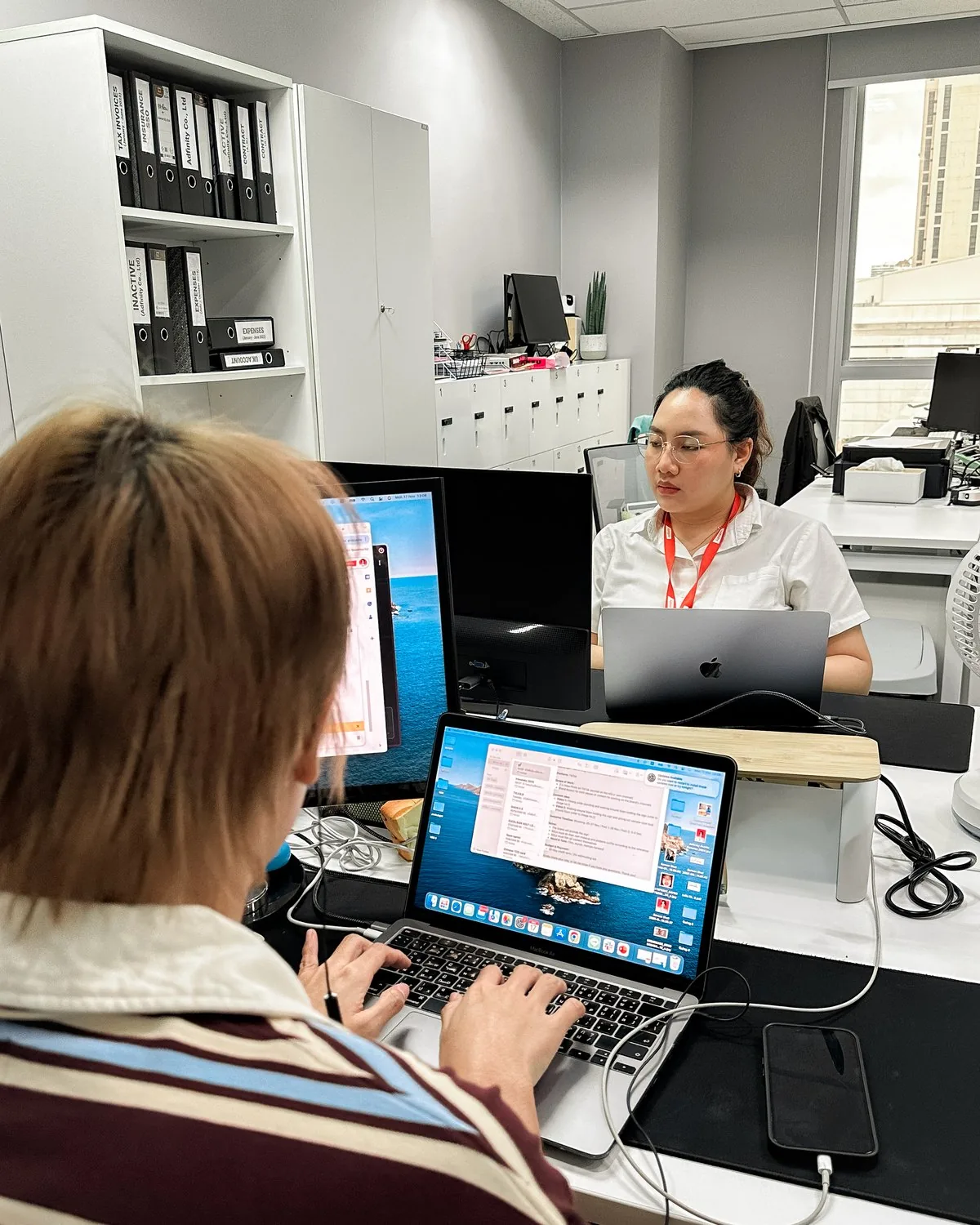 Adfinity specialist working on SEO and search analytics on a laptop