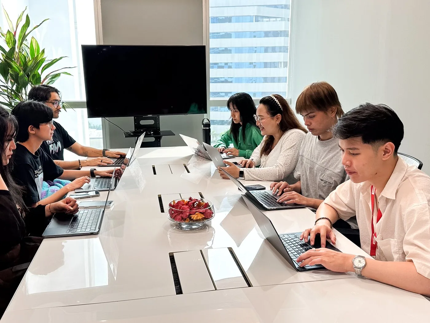 Adfinity team reviewing e-commerce performance at their desks