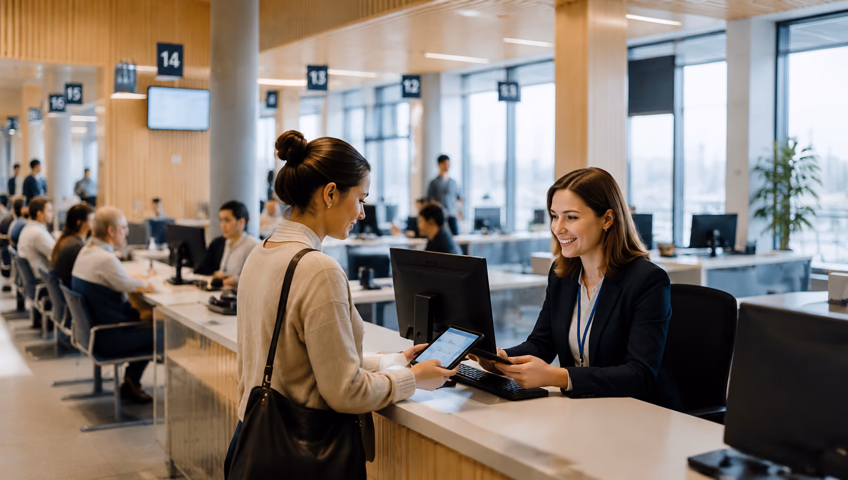 Public service office with staff helping a visitor