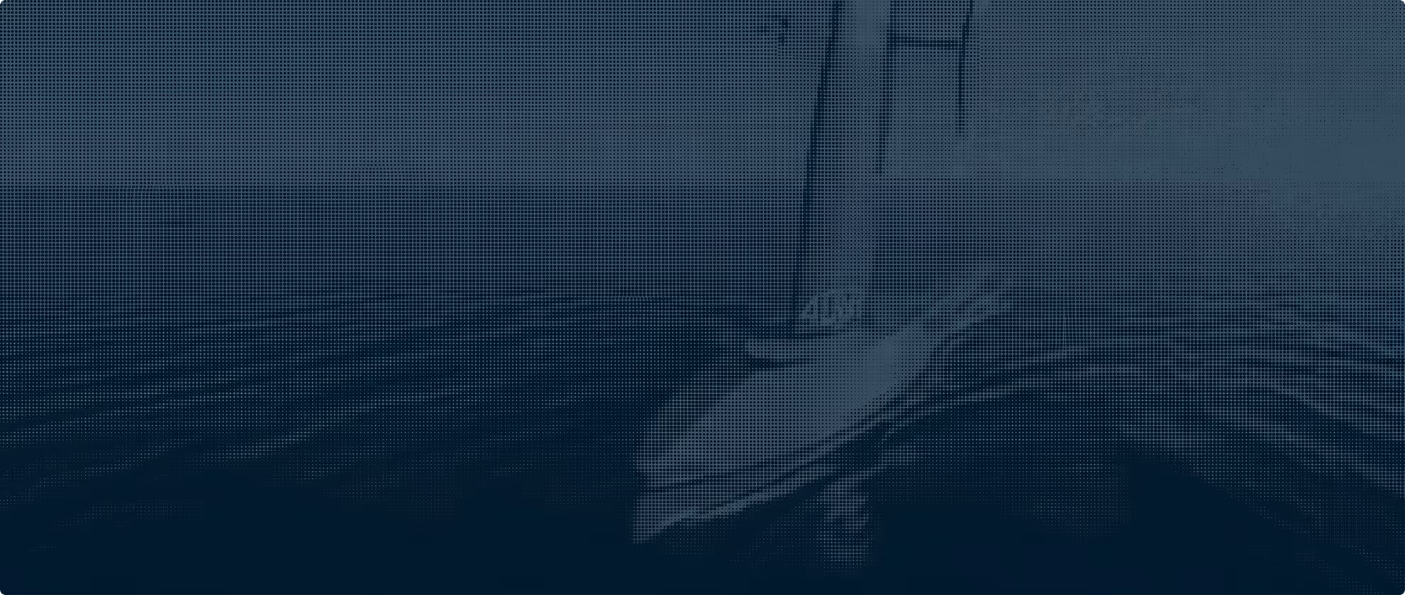Saildrone sailing on wavy water under a cloudy sky.