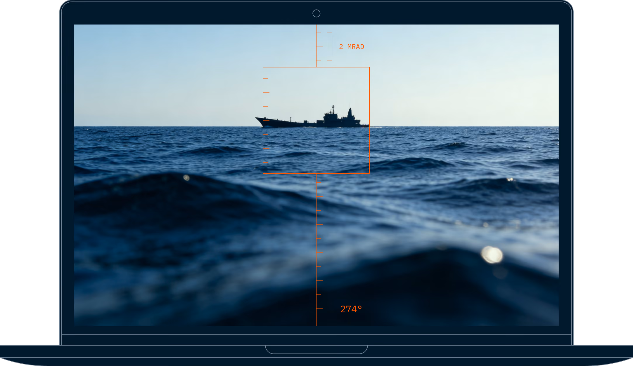 Laptop screen shows a ship visible through a digital targeting reticle over ocean waves under a clear sky.
