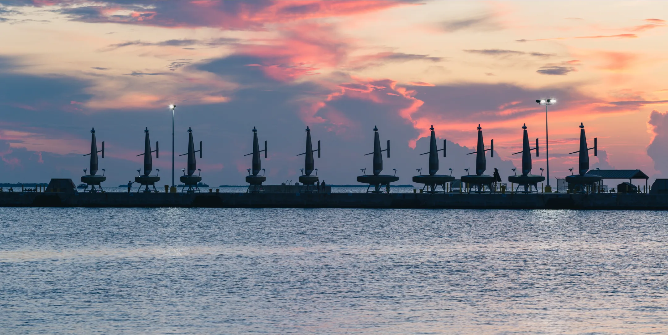 A row of saildrones ready to be deployed
