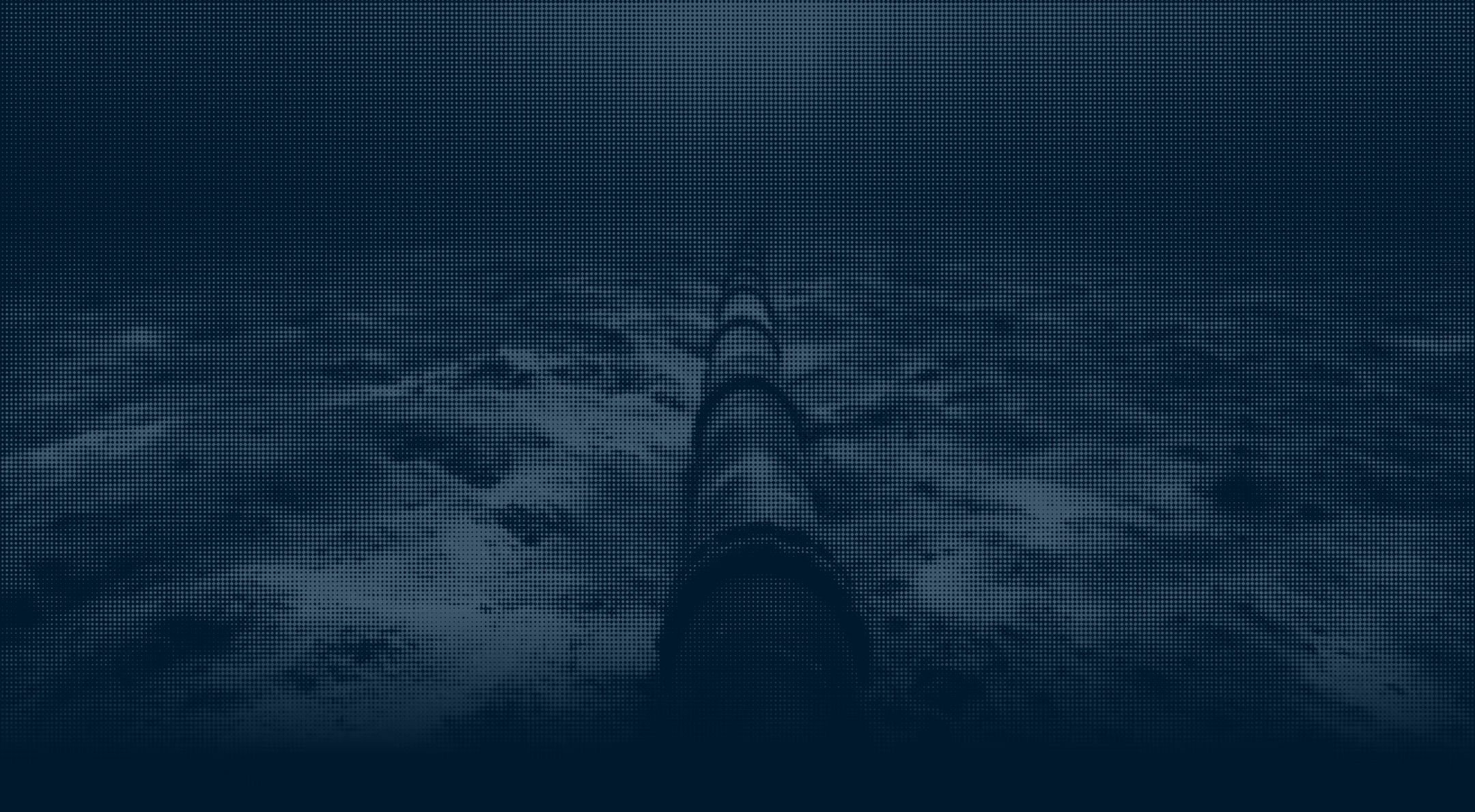 Subsea pipeline stretching across the ocean floor under deep blue water.