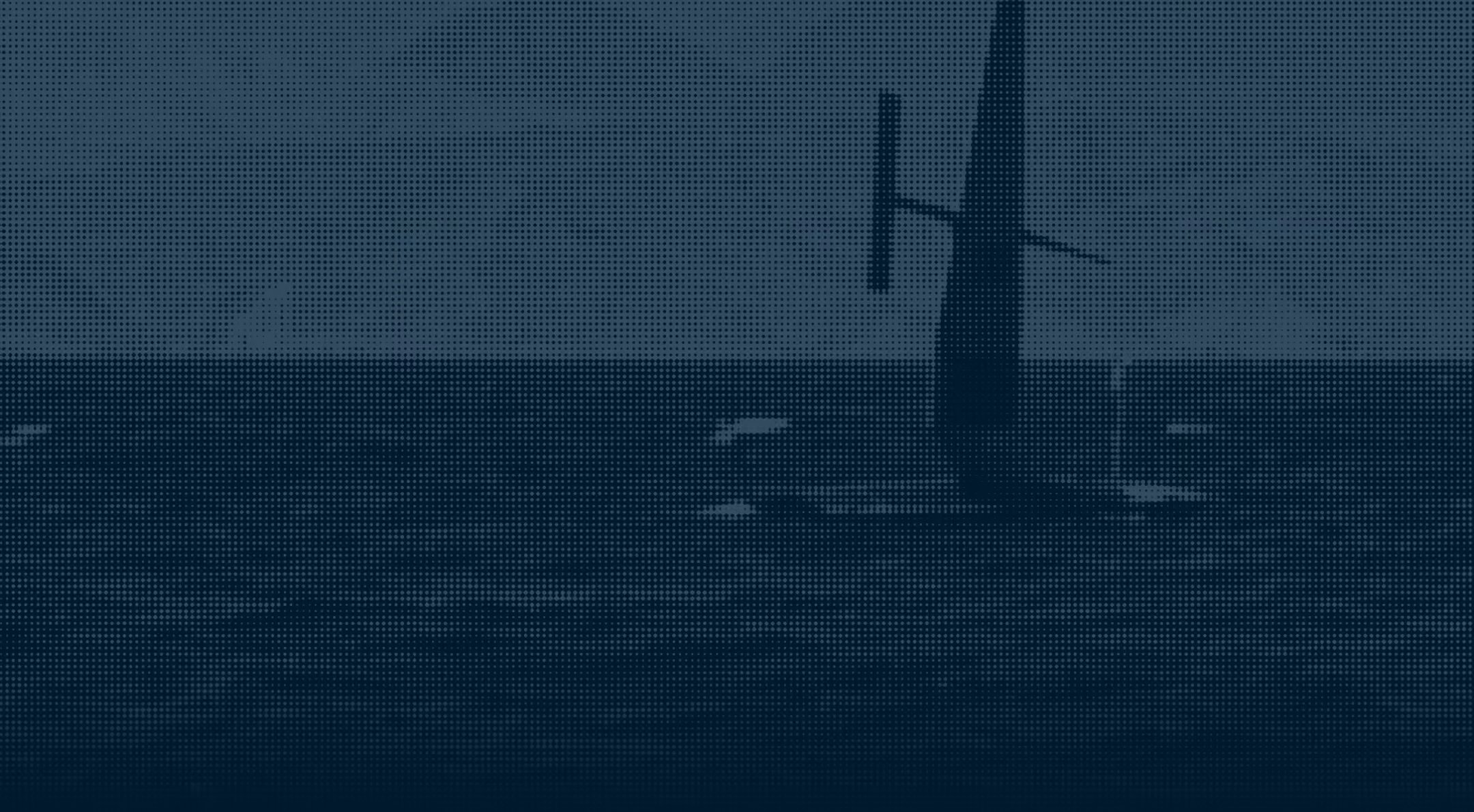 Saildrone floating on calm water under a clear sky.