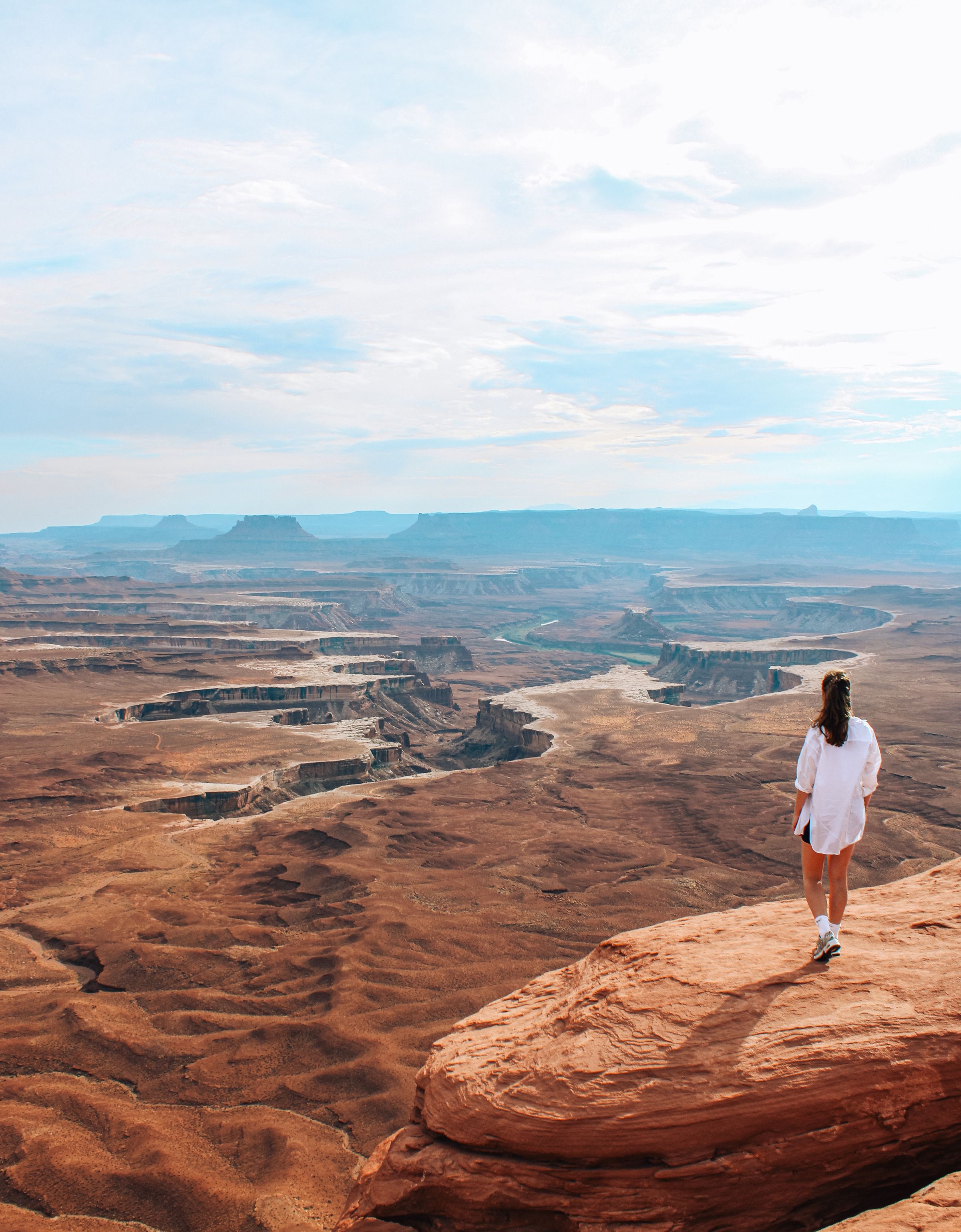 View over a canyon with a person looking out across the valley