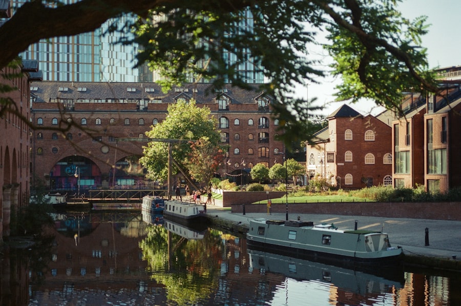Canal with narrow boats and brick buildings, Greater Manchester